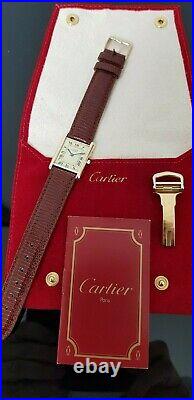 Must de Cartier Tank Gold on Silver Mid Size Watch in Cartier Red Suede Pouch